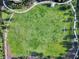 Aerial view of a community park with open green space, walking paths and soccer goals at 7617 Brookhurst Ln, Kissimmee, FL 34747