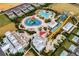 Aerial view of community with pools, waterpark, and clubhouse at 7617 Brookhurst Ln, Kissimmee, FL 34747