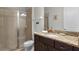 Clean bathroom with granite countertop and walk-in shower at 7617 Brookhurst Ln, Kissimmee, FL 34747
