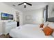 Spacious bedroom with king-size bed, dresser, and TV at 7617 Brookhurst Ln, Kissimmee, FL 34747