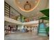 Bright and spacious lobby with a high ceiling and staircase at 7617 Brookhurst Ln, Kissimmee, FL 34747