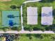 Aerial view of a community basketball court and sand volleyball courts at 7617 Brookhurst Ln, Kissimmee, FL 34747