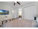 Bedroom with a queen bed and en-suite bathroom at 7617 Brookhurst Ln, Kissimmee, FL 34747