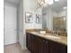 Double vanity bathroom with granite countertop and shower at 7617 Brookhurst Ln, Kissimmee, FL 34747