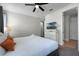 King bedroom with TV, dresser and ensuite bathroom at 7617 Brookhurst Ln, Kissimmee, FL 34747