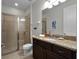 Clean bathroom with granite countertop and walk-in shower at 7617 Brookhurst Ln, Kissimmee, FL 34747