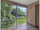 Screened porch overlooking a lush green backyard at 4611 Gate Pl # H-203, Orlando, FL 32811