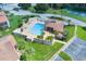 Aerial view of community pool, patio, and surrounding landscape at 4611 Gate Pl # H-203, Orlando, FL 32811