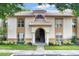 Front view of condo building with stairs and entrance at 4611 Gate Pl # H-203, Orlando, FL 32811