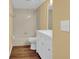 Updated bathroom with a bathtub and modern vanity at 4611 Gate Pl # H-203, Orlando, FL 32811
