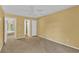 Comfortable bedroom with access to a bathroom and hallway at 4611 Gate Pl # H-203, Orlando, FL 32811