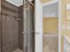 Clean bathroom with a shower and neutral tile at 4611 Gate Pl # H-203, Orlando, FL 32811