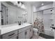 Bathroom with single vanity, bathtub, and floral shower curtain at 2195 Bluebird Pl, St Cloud, FL 34771