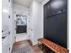 Entryway with bench, coat hooks, and view of laundry room at 2195 Bluebird Pl, St Cloud, FL 34771