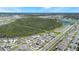 Aerial view of a neighborhood with houses and green areas at 2195 Bluebird Pl, St Cloud, FL 34771
