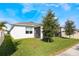 House with backyard, screened patio, and lawn at 2195 Bluebird Pl, St Cloud, FL 34771
