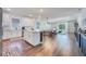 Open concept kitchen, dining, and living area with hardwood floors at 2195 Bluebird Pl, St Cloud, FL 34771
