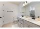 Modern bathroom with double vanity, walk-in shower, and tile flooring at 2195 Bluebird Pl, St Cloud, FL 34771