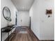 Clean entryway with wood-look floors, a console table, and a full-length mirror at 2195 Bluebird Pl, St Cloud, FL 34771