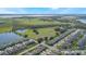 Aerial view of a neighborhood with undeveloped land at 2195 Bluebird Pl, St Cloud, FL 34771