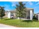 House with backyard, screened patio, and lawn at 2195 Bluebird Pl, St Cloud, FL 34771