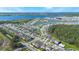 Aerial view of a residential community near a lake at 2195 Bluebird Pl, St Cloud, FL 34771