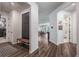 Bright entryway with a bench, coat rack, and views into other rooms at 2195 Bluebird Pl, St Cloud, FL 34771