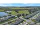 Aerial view of community with lake and houses at 2195 Bluebird Pl, St Cloud, FL 34771