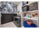 Laundry room with washer, dryer, and ample shelving at 2195 Bluebird Pl, St Cloud, FL 34771