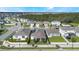 Aerial view of a residential neighborhood with houses and green spaces at 2195 Bluebird Pl, St Cloud, FL 34771