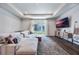 Spacious living room with large sectional sofa and sliding glass doors at 2195 Bluebird Pl, St Cloud, FL 34771