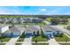 Aerial view of houses with solar panels in a residential community at 2195 Bluebird Pl, St Cloud, FL 34771