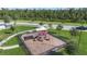 Community playground with shaded structure, slides, and climbing equipment at 2195 Bluebird Pl, St Cloud, FL 34771