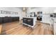 Modern kitchen with white cabinets, stainless steel appliances, and an island at 2195 Bluebird Pl, St Cloud, FL 34771