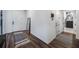 Modern entryway with wood-look floors, leading to other rooms in the house at 2195 Bluebird Pl, St Cloud, FL 34771