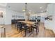 Modern farmhouse dining area with a long wooden table and black chairs at 2195 Bluebird Pl, St Cloud, FL 34771
