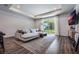 Spacious living room with a sectional sofa, large windows, and wood-look flooring at 2195 Bluebird Pl, St Cloud, FL 34771