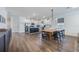 Bright dining area with a long wooden table and black chairs at 2195 Bluebird Pl, St Cloud, FL 34771
