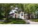 Beautiful home with a large front yard and mature trees at 5126 Fairway Oaks Dr, Windermere, FL 34786