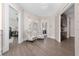 Stylish hallway with two comfortable armchairs and access to bedrooms at 5126 Fairway Oaks Dr, Windermere, FL 34786