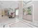 Bright and spacious entryway with marble flooring and double doors at 5126 Fairway Oaks Dr, Windermere, FL 34786
