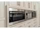 Modern kitchen features Wolf microwave and oven, and a built-in coffee system at 5126 Fairway Oaks Dr, Windermere, FL 34786