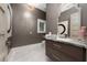 Elegant powder room with marble vanity and statement mirror at 5126 Fairway Oaks Dr, Windermere, FL 34786