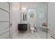 Modern bathroom with floating vanity and glass shower at 5126 Fairway Oaks Dr, Windermere, FL 34786