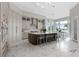 Gourmet kitchen with large island, stainless steel appliances, and ample cabinetry at 5126 Fairway Oaks Dr, Windermere, FL 34786