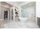 Spa-like bathroom featuring a freestanding tub and glass shower at 5126 Fairway Oaks Dr, Windermere, FL 34786