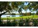 Scenic view of a lake and golf course from a backyard at 5126 Fairway Oaks Dr, Windermere, FL 34786