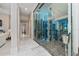 Modern glass-enclosed wine cellar with extensive wine collection at 5126 Fairway Oaks Dr, Windermere, FL 34786