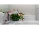 Vanity with modern faucet and fresh flowers at 5126 Fairway Oaks Dr, Windermere, FL 34786