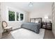 Serene bedroom with plush bedding and plenty of natural light at 5126 Fairway Oaks Dr, Windermere, FL 34786